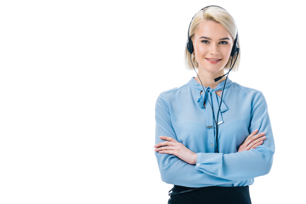 attractive operator with crossed arms working in headset, isolated on white - Фото, изображение