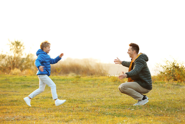 Father with little son playing outdoors - Foto, Imagem