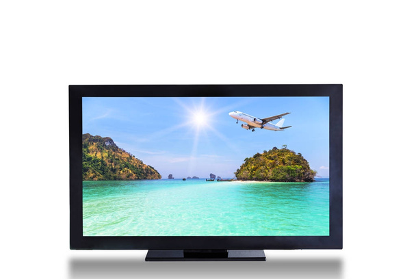 television TV screen with airplane landing above small island in blue sea and tropical beach landscape picture isolated on white background - Photo, Image