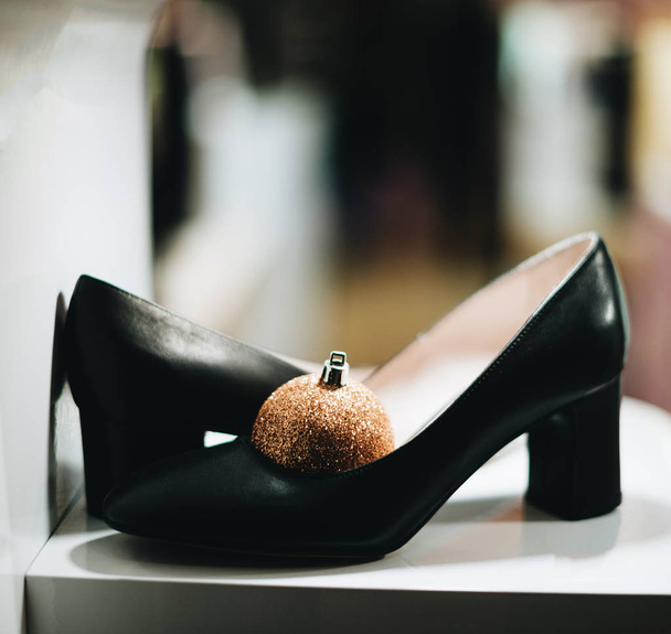 Female heels with globe during Christmas sale - Photo, Image