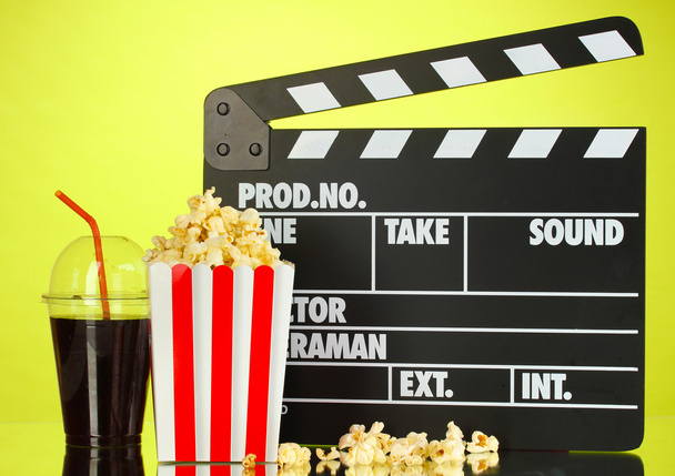 Movie clapperboard, cola and popcorn on background - Fotoğraf, Görsel