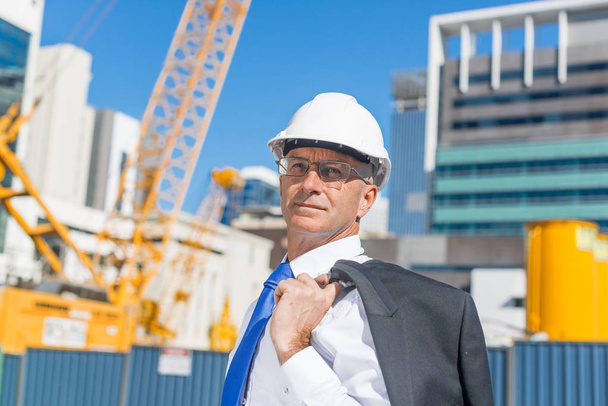 Confident construction engineer in hardhat  - Фото, изображение