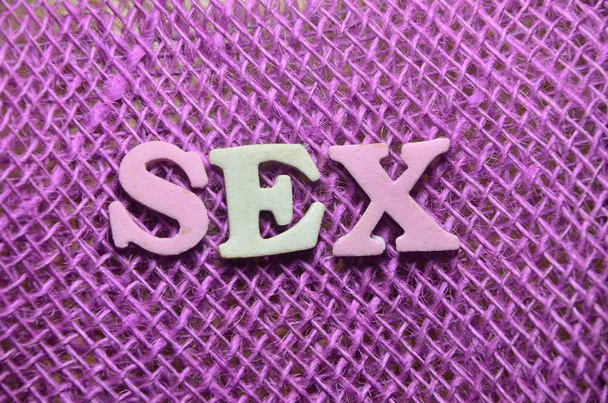 λέξη σεξ σε μια αφηρημένη έγχρωμο φόντο - Φωτογραφία, εικόνα