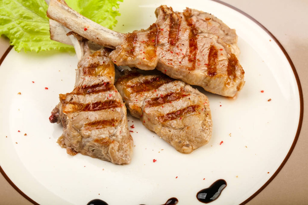 Grilled lamb with tomato sauce served salad leaves - Photo, Image
