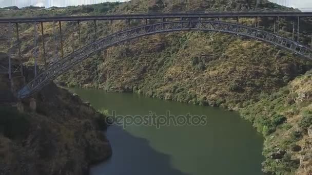 Vertigo effect under iron bridge over river - Footage, Video