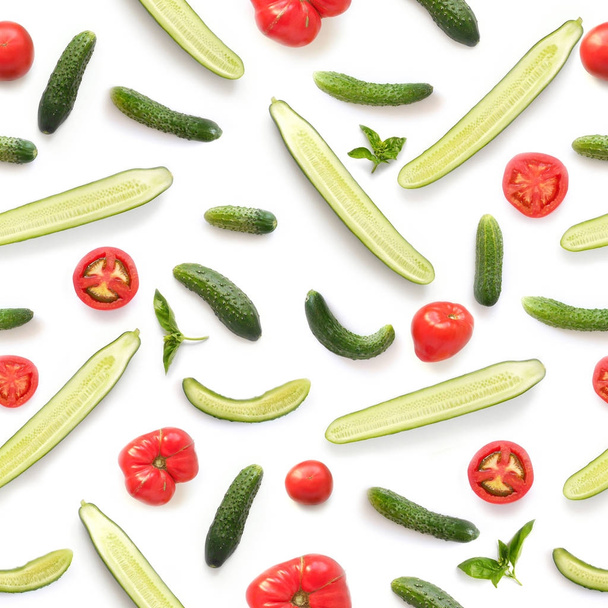 Seamless pattern of fresh tomatoes, cucumbers and green basil isolated on white background, top view - Photo, image
