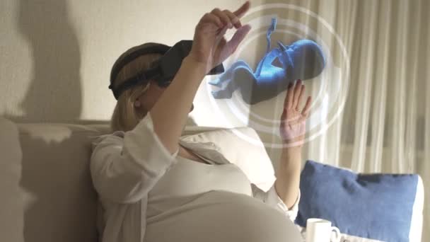 pregnant girl with glasses virtual reality - Кадри, відео