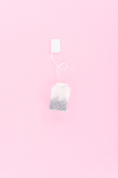 top view of one tea bag isolated on pink - Foto, Bild