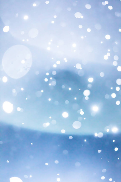 Wet and Smugy Lens Flare and Blurry Snowflakes or Filter Background during Snowstorm at Night - Foto, Imagen