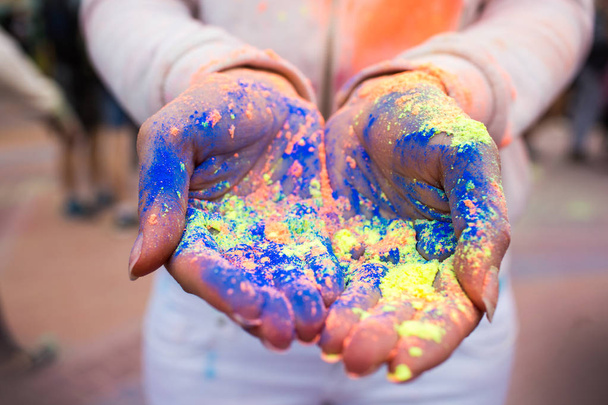 Hands of young people with Indian dyes on Holi color festival - Фото, зображення