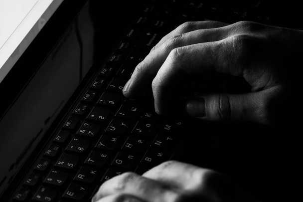 Internet crime concept.Hacker on dark blue digital background - Valokuva, kuva