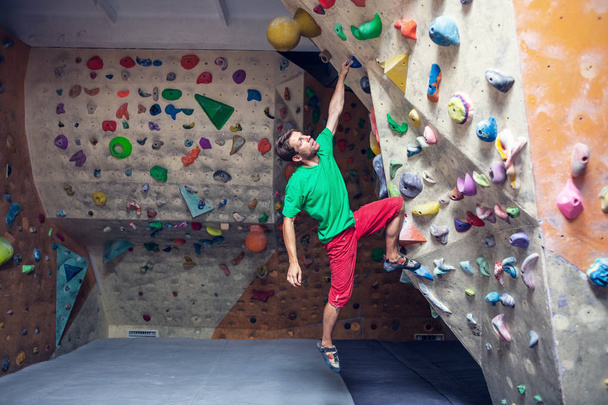 Rock climbing in the gym. - Fotó, kép