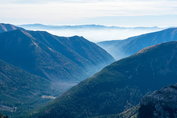 view on valley with fog in Tatra mountain in Slovakia - Photo, Image