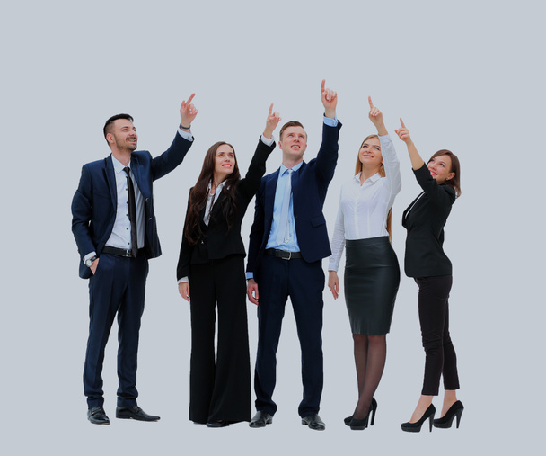 business people in a row pointing and looking up to copy space isolated on white background. - Фото, зображення