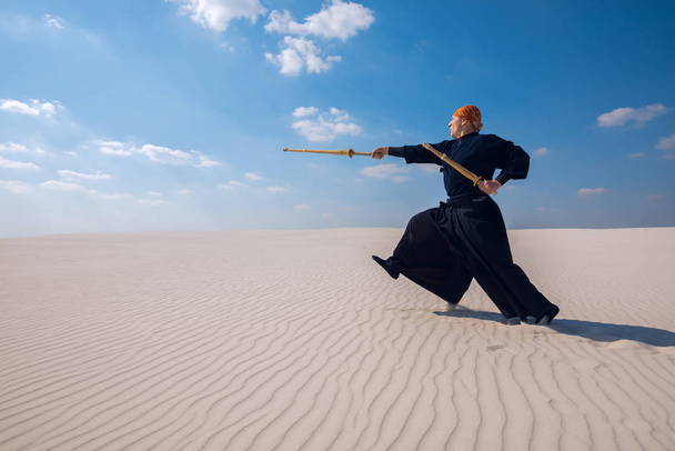 Energetic caucasian man is practicing martial arts  - Foto, imagen
