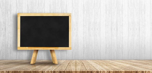 Blackboard menu with easel on wooden table with white wooden wal - Фото, зображення