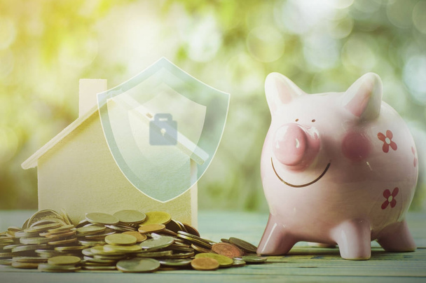 financiamento de proteção sobre casa e casa e conceito de dinheiro com empilhamento de moeda
 - Foto, Imagem
