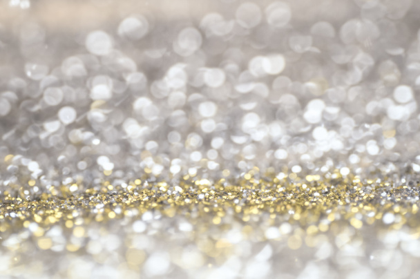 Defocus glitter vintage verlichting achtergrond. goud, zilver en zwart voor Kerstmis en Nieuwjaar achtergrond. - Foto, afbeelding