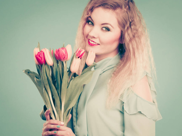 Woman holding bouquet of tulips flowers - Zdjęcie, obraz