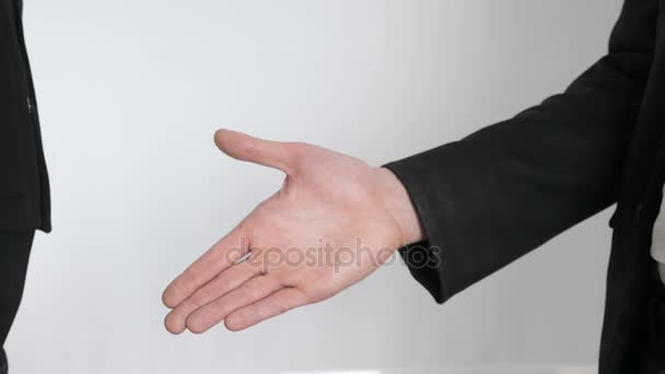 A young man and a girl in suits shake hands. Female and man hands shaking hands. Close up 60 fps - Footage, Video