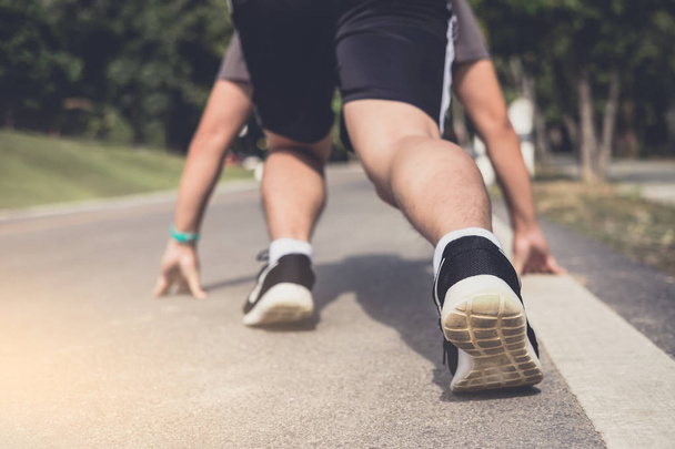 Close up on shoes, athlete runner feet running on track to begin - Foto, Imagem