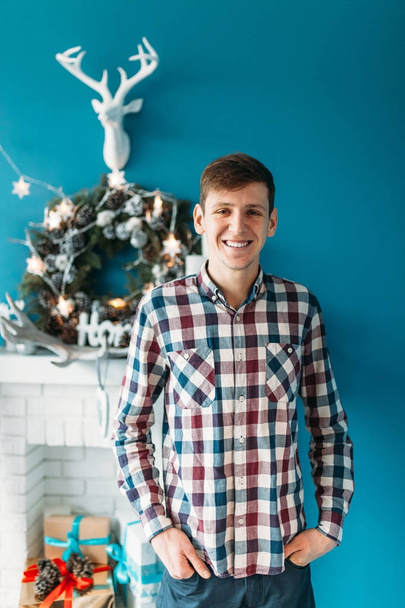 Beautiful portrait of a man, in shirt, Christmas studios, Christmas cheer - Fotografie, Obrázek