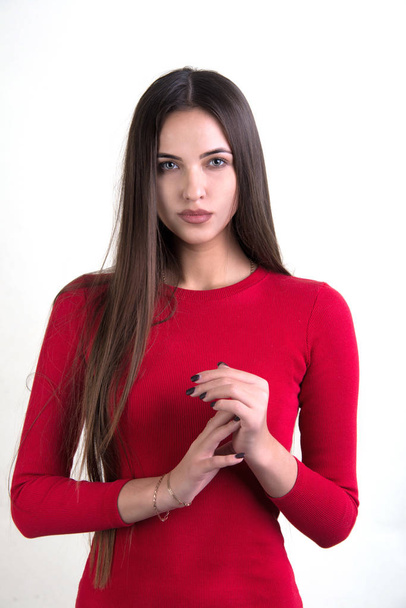 Young woman in red dress posing - Fotoğraf, Görsel