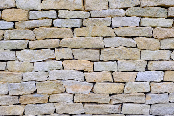 Dekoratív kőfal textúra természetes háttérszín. - Fotó, kép
