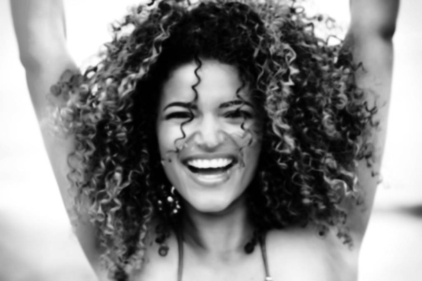Out of focus portrait of gorgeous and cheerful young woman, monochrome - Fotó, kép