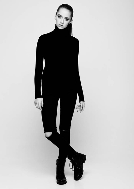 Young beautiful fashion model wearing black polo - Foto, imagen