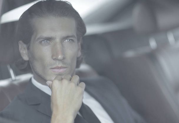 closeup.successful businessman sitting in the car - Foto, Imagem