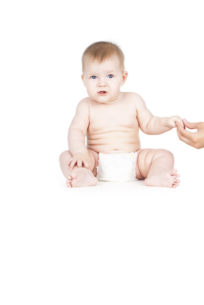 naked child is in diapers - Foto, afbeelding