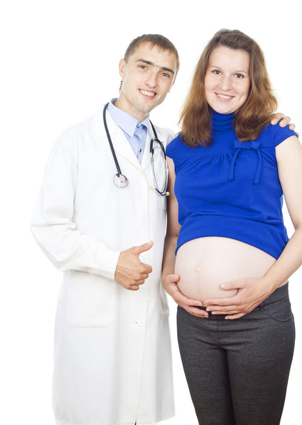 physician indicates on the abdomen of pregnant girl - Foto, imagen
