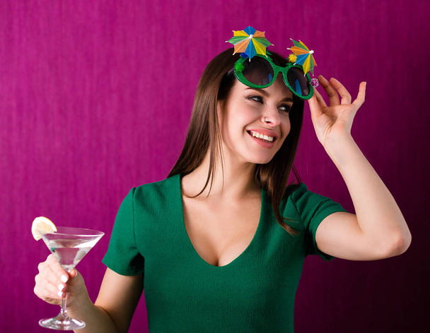 Woman wearing party glasses celebrates St. Patrick's Day - Photo, Image