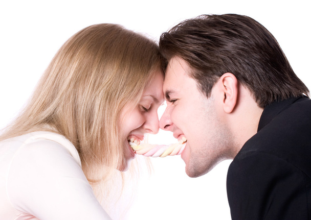 Man and woman fighting for a sweets - Foto, Imagem