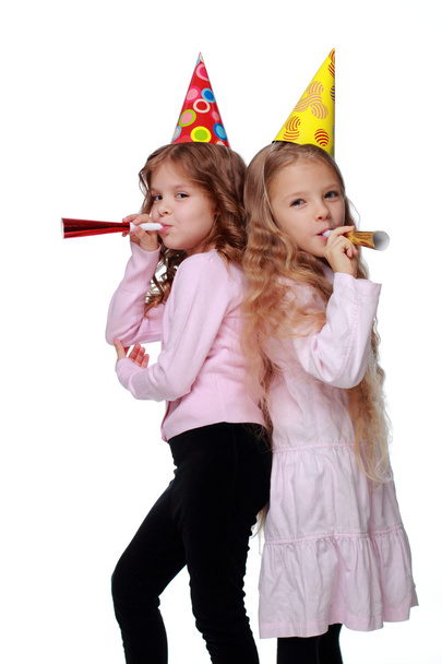Party girls blowing noisemakers - Φωτογραφία, εικόνα