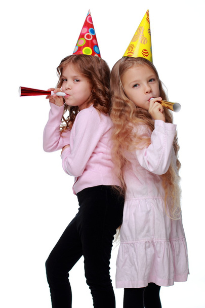 Party girls blowing noisemakers - Foto, Imagem