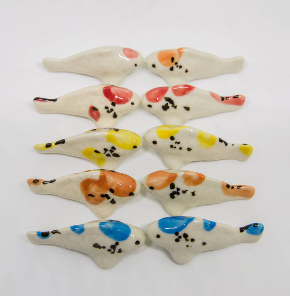 Риби Кераміка на білому тлі
 - Фото, зображення