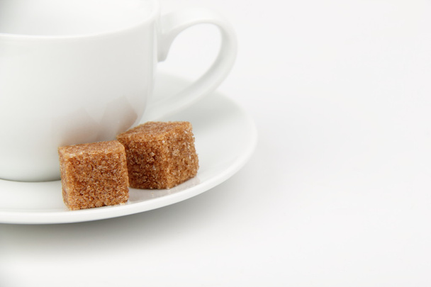 Cup and brown cane sugar - Photo, image