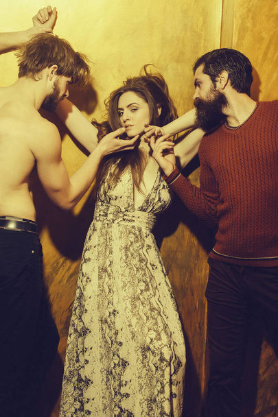 Pretty girl and two bearded men with beards - Foto, imagen