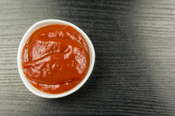 Ketchup in a bowl. View from above. - Fotoğraf, Görsel