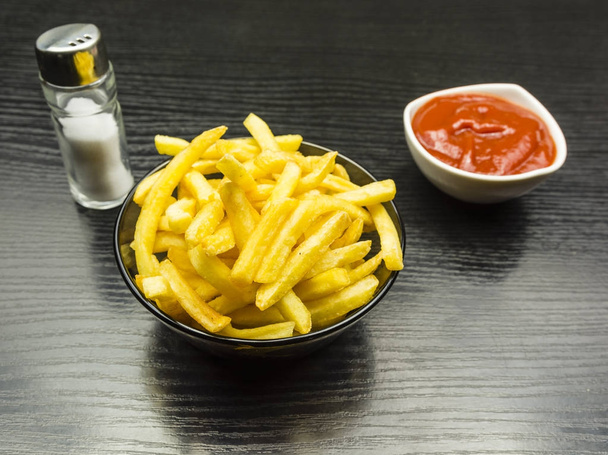 Salted fries and ketchup in a bowl. - Photo, Image