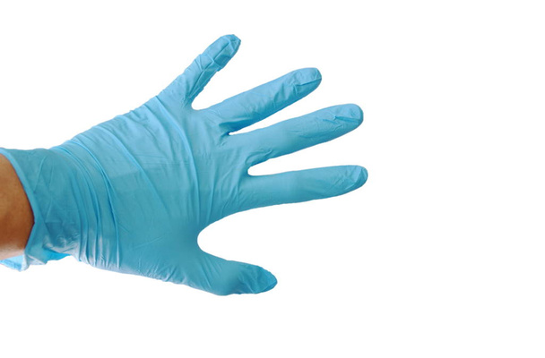 main en gant de caoutchouc bleu sur fond blanc
 - Photo, image