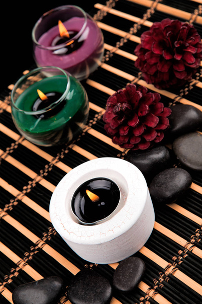Aromatherapy. Candles and spa objects on black background - Fotoğraf, Görsel