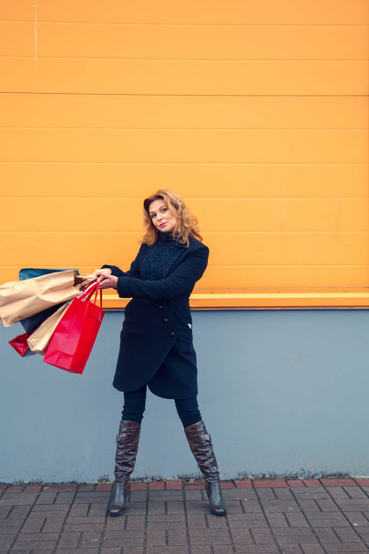 Beautiful woman with shopping bags. - Фото, изображение