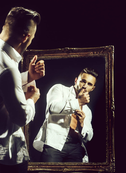 muscular macho man with sexy athlete body near vintage mirror - Fotografie, Obrázek