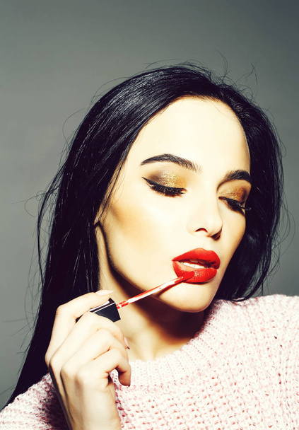 sexy woman with red lips and long hair hold mascara - Φωτογραφία, εικόνα