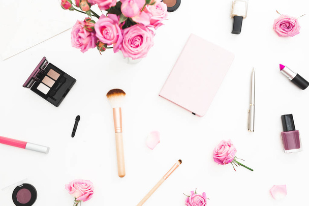 Woman workspace with pink roses, cosmetics, diary on white background. Top view. Flat lay. Valentines day. - Φωτογραφία, εικόνα