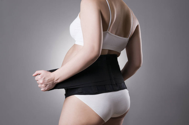Pregnant woman with orthopedic support belt, pregnancy bandage - Foto, Imagem