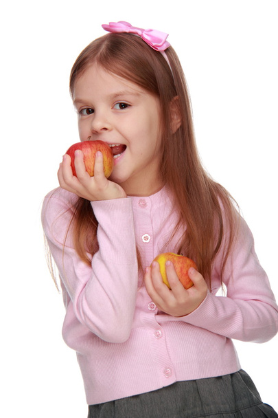 Little girl holding two apples - 写真・画像